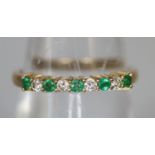 9ct gold emerald and diamond half eternity style ring. Ring size N. Approx weight 1.5 grams. (B.P.
