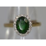 9ct gold oval green stone and diamond ring. Ring size O. Approx weight 2.2 grams. (B.P. 21% + VAT)
