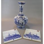 Dutch Delft blue and white baluster vase decorated with sailing barges and windmills on foliate