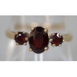 9ct gold three stone garnet ring. Ring size P. Approx weight 1.9 grams. (B.P. 21% + VAT)