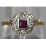 Yellow metal ruby and diamond ring. Ring size Q. Approx weight 3.2 grams. (B.P. 21% + VAT)
