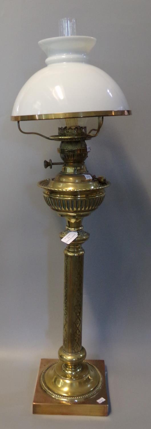 Early 20th Century brass double oil burner lamp, having opaline glass mushroom shade, fluted