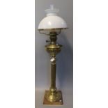 Early 20th Century brass double oil burner lamp, having opaline glass mushroom shade, fluted