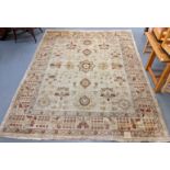 Large cream ground multi coloured floral and foliate carpet. 319x249cm approx. (B.P. 21% + VAT)