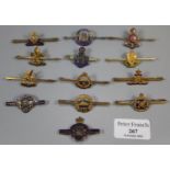 Collection of military type pin bar brooches, to include: South Wales Borderers, Royal Artillery,