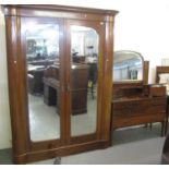 Edwardian mahogany ornately inlaid two piece bedroom suit, to include: large mirrored double door