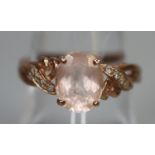 9ct rose gold ring set with pink stones and diamonds. Ring size O. Approx weight 2.5 grams. (B.P.