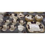 Two trays of Coalport English china 'batwing' design teaware including: teacups and saucers, plates,