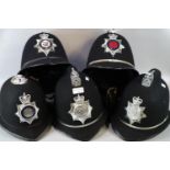 Two boxes comprising five police helmets, to include: Ministry of Defence Police, Heddlu Gwent