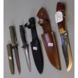 Military style fighting knife with leather scabbard, another military style knife with metal
