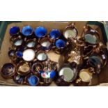 Box of assorted copper lustre items, mostly dresser jugs in various sizes, pedestal pots, conserve