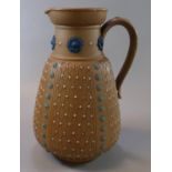 Late 19th Century Doulton Lambeth silicon ware jug, with raised flowerheads and geometric