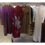 Collection of vintage clothing to include: light brown 3/4 length fur coat, a similar faux fur