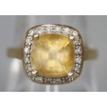 9ct gold yellow stone and diamond ring. Ring size O&1/2. Approx weight 2.9 grams. (B.P. 21% + VAT)