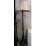 Modern hardwood standard lamp on circular base with shade. (B.P. 21% + VAT)