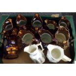 Box of assorted dresser jugs to include: copper lustre and two cream jugs with raised Grecian figure
