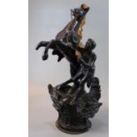 Painted spelter Marley horse group, the base in the form of a winged helmet. 36cm high approx. One