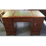 Reproduction mahogany finish knee hole desk with leather inset top. (B.P. 21% + VAT)