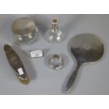 Collection of assorted silver vanity items, to include: hand mirror, brush, jar and cover,