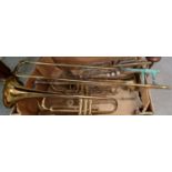Box comprising brass trumpets, to include: 'Boosey & Hawkes 400' and two others. (B.P. 21% + VAT)