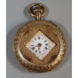 14ct gold engraved fancy keyless fob watch with Roman ceramic face. 22g approx. (B.P. 21% + VAT)