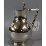 Silver plated baluster shaped 'Tenby' jug with angular insulated handle, in the manor of Christopher