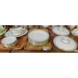Three trays of Royal Doulton English translucent china 'Berkshire' design dinnerware to include: two