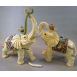 Two similar decorative resin elephants with coloured decoration. 41cm high approx. (2) (B.P. 21% +