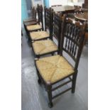 Set of four Lancashire style oak spindle back dining chairs with rush seats on turned supports and