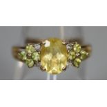 9ct gold ring set with yellow and green stones. Ring size O & 1/2. Approx weight 3 grams. (B.P.