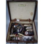 Leather suitcase, to include: vintage GWR wooden carriage warning tags, various lighters, coins, cut