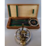 Brass miner's dial, un-named with inset silvered scale, compass and adjustable mirror, together with