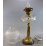 Early 20th century oil lamp base now converted to electricity, having etched globular shade,