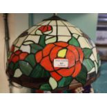 Tiffany style ceiling light shade, overall decorated with roses and foliage. (B.P. 21% + VAT)