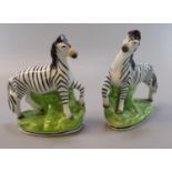 Pair of Staffordshire Pottery flat Back figures of standing Zebras on naturalistic bases. (2) (B.