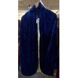 Early 20th Century blue velvet cape with button fastening and silky fabric lining. (B.P. 21% + VAT)