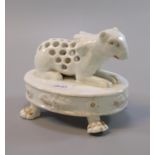 19th century Continental porcelain flower/quill holder in the form of a stylised recumbent bear. (