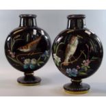 Pair of Victorian opaline glass flask shaped vases on a black ground hand painted with birds,