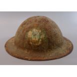 Probably WWI British Army tin helmet, painted with Prince of Wales Feathers device. (B.P. 21% + VAT)