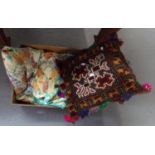 Carpet covered cushion with multi-coloured fringe and a vintage floral quilted bedspread. (2) (B.