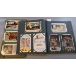 Postcards collection in two old albums of greeting cards and humorous cards. (B.P. 21% + VAT)