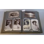 Postcards collection in old album. Actresses, pretty ladies, children, plus some topographical
