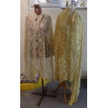 Two late 19th/early 20th Century lace shawls, one gold and one beige, both with floral pattern. (
