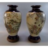 Pair of Japanese Meiji period Satsuma baluster shaped vases with reserve panels of figures in