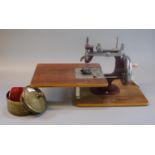 Vintage miniature sewing machine with brass jar and cover, probably Indian. (B.P. 21% + VAT)