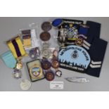 Plastic box of assorted National small bore Rifle Association medals, coins, all to ' P Dyche',