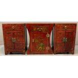 Pair of Chinese lacquered bedside cupboards or cabinets, the front overall with buttefly, floral and