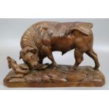 Johann Huggler (1834-1912), a Black Forest carved probably walnut figure group of a bull goring a