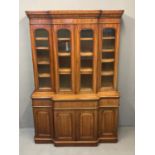 Victorian mahogany two stage break front book case, the moulded and shaped cornice above four dome