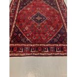 Large Persian Joshaghan carpet, with diamond medallion design and stylised flower and foliate